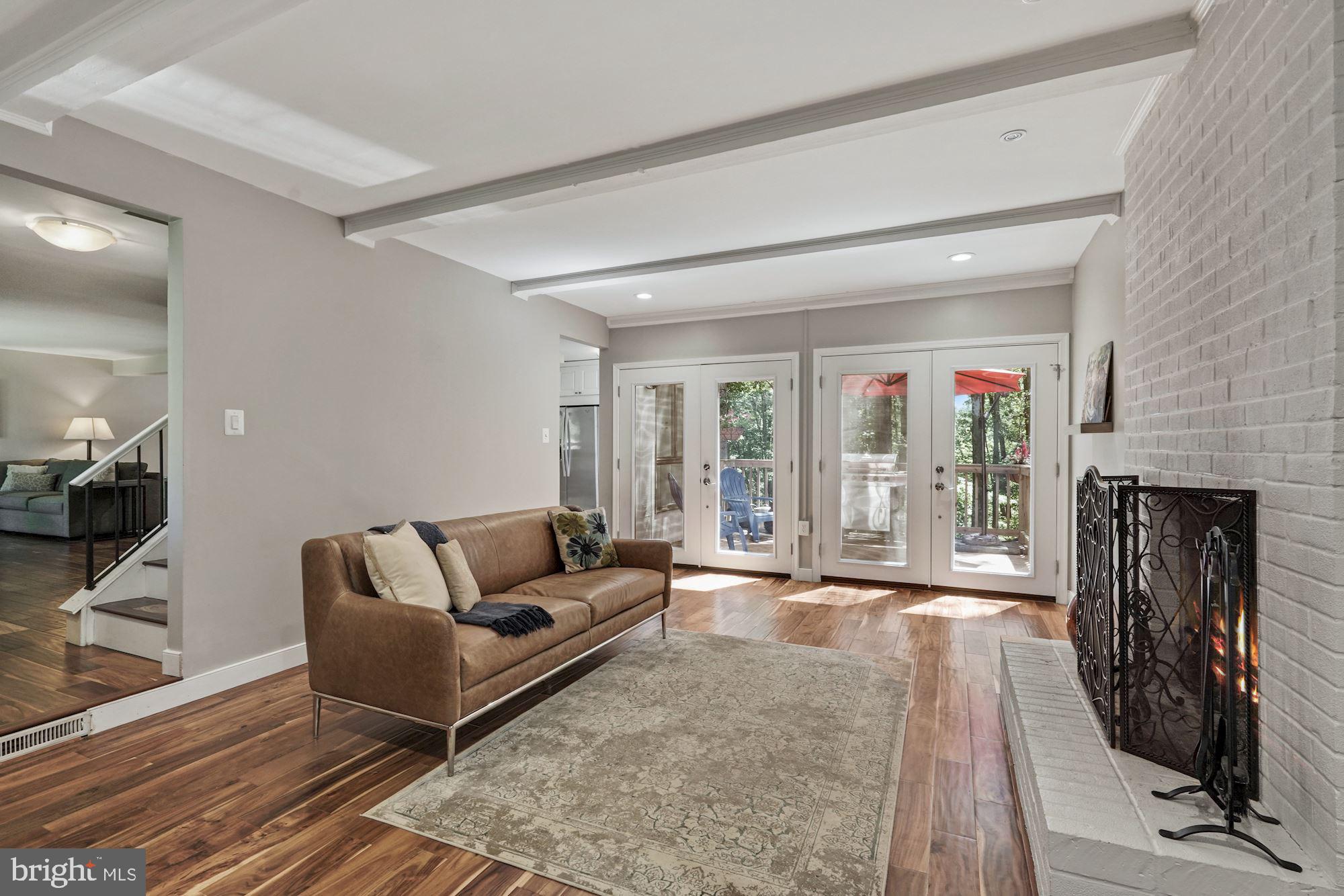 2119 Thomas View Road Reston, VA 20191 - Photo 15 of 41 a living room with fireplace furniture and a wooden floor