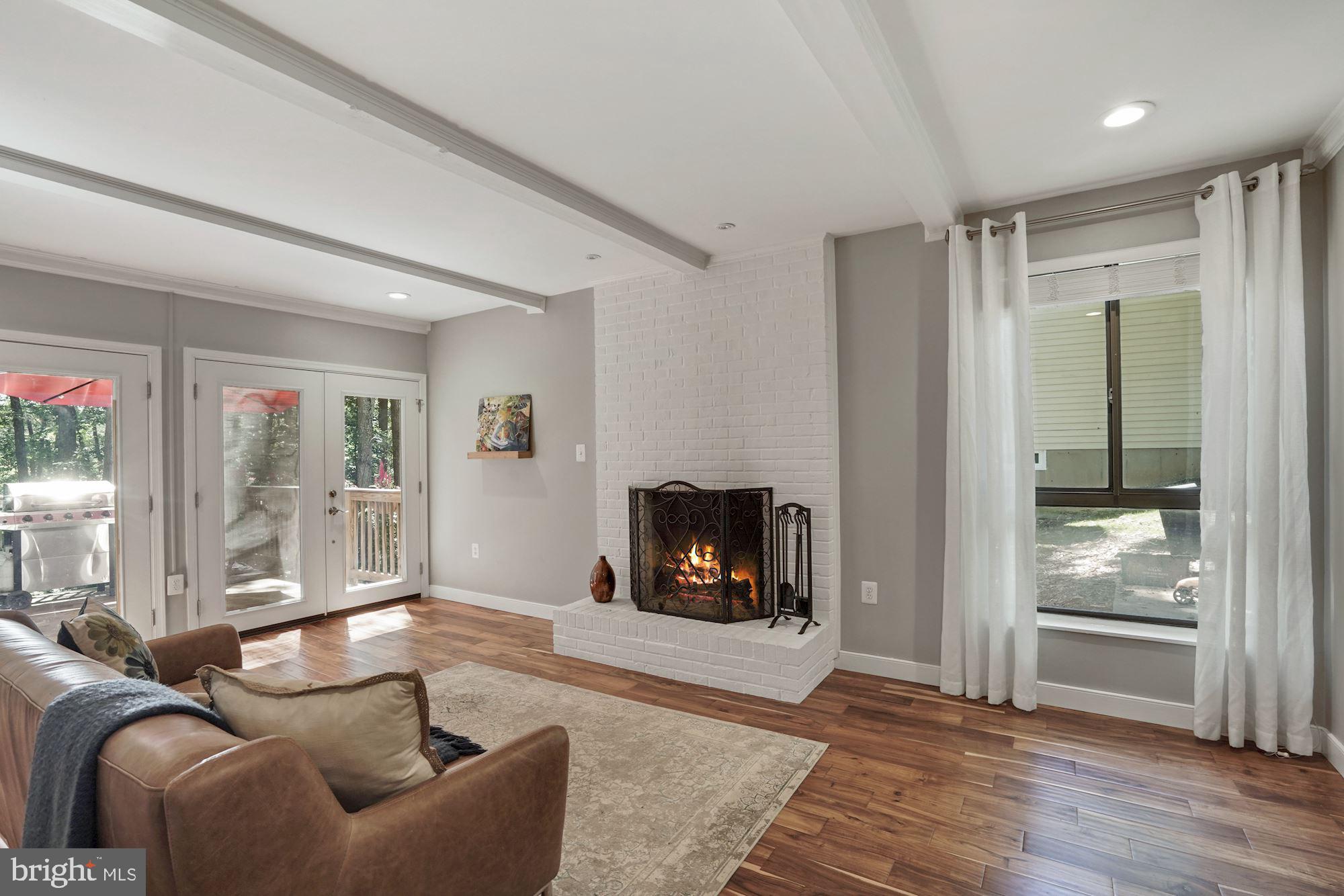 2119 Thomas View Road Reston, VA 20191 - Photo 16 of 41 a living room with furniture and a fireplace