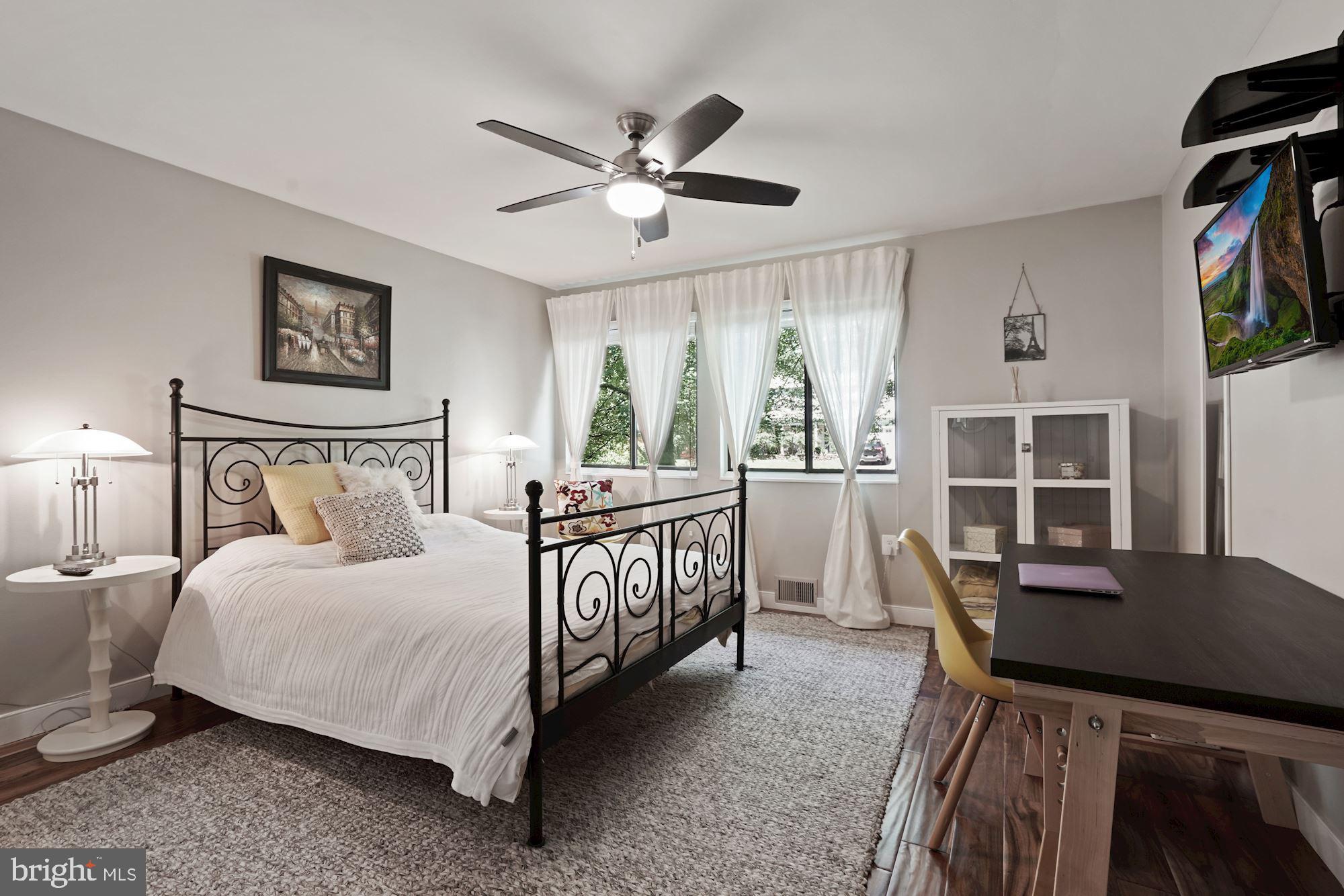 2119 Thomas View Road Reston, VA 20191 - Photo 25 of 41 a bedroom with a bed window and a table