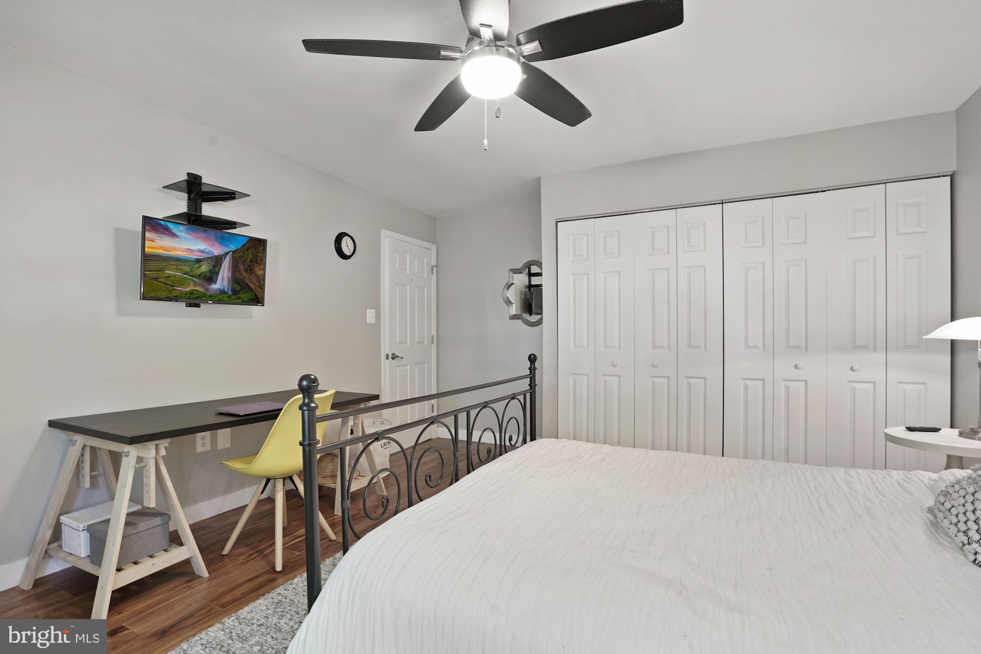 2119 Thomas View Road Reston, VA 20191 - Photo 26 of 41 a bedroom with a bed and a chandelier