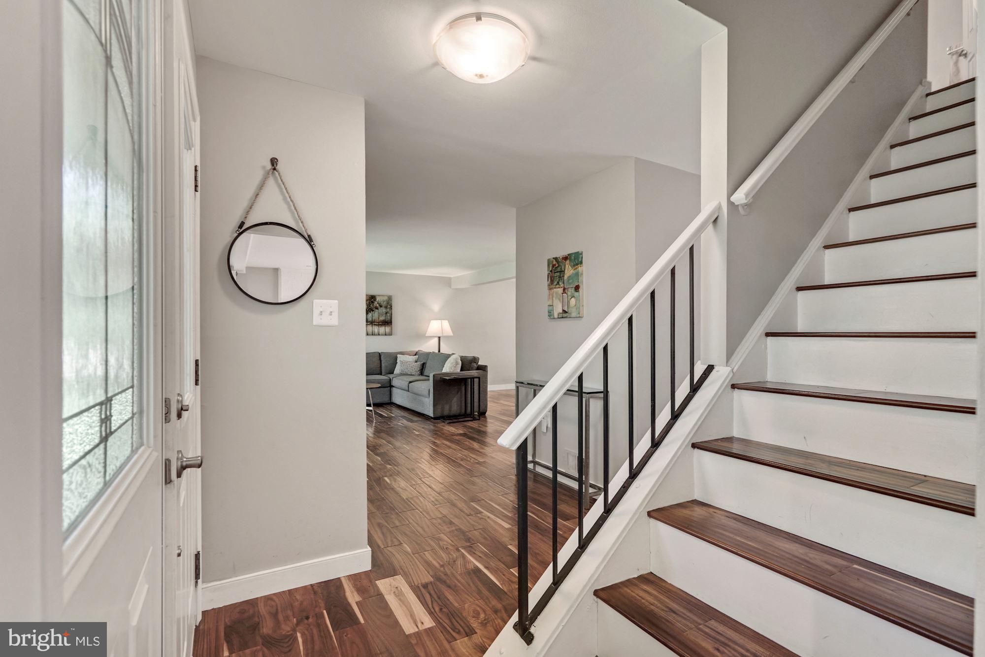 2119 Thomas View Road Reston, VA 20191 - Photo 4 of 41 a view of a room with wooden floor and white walls