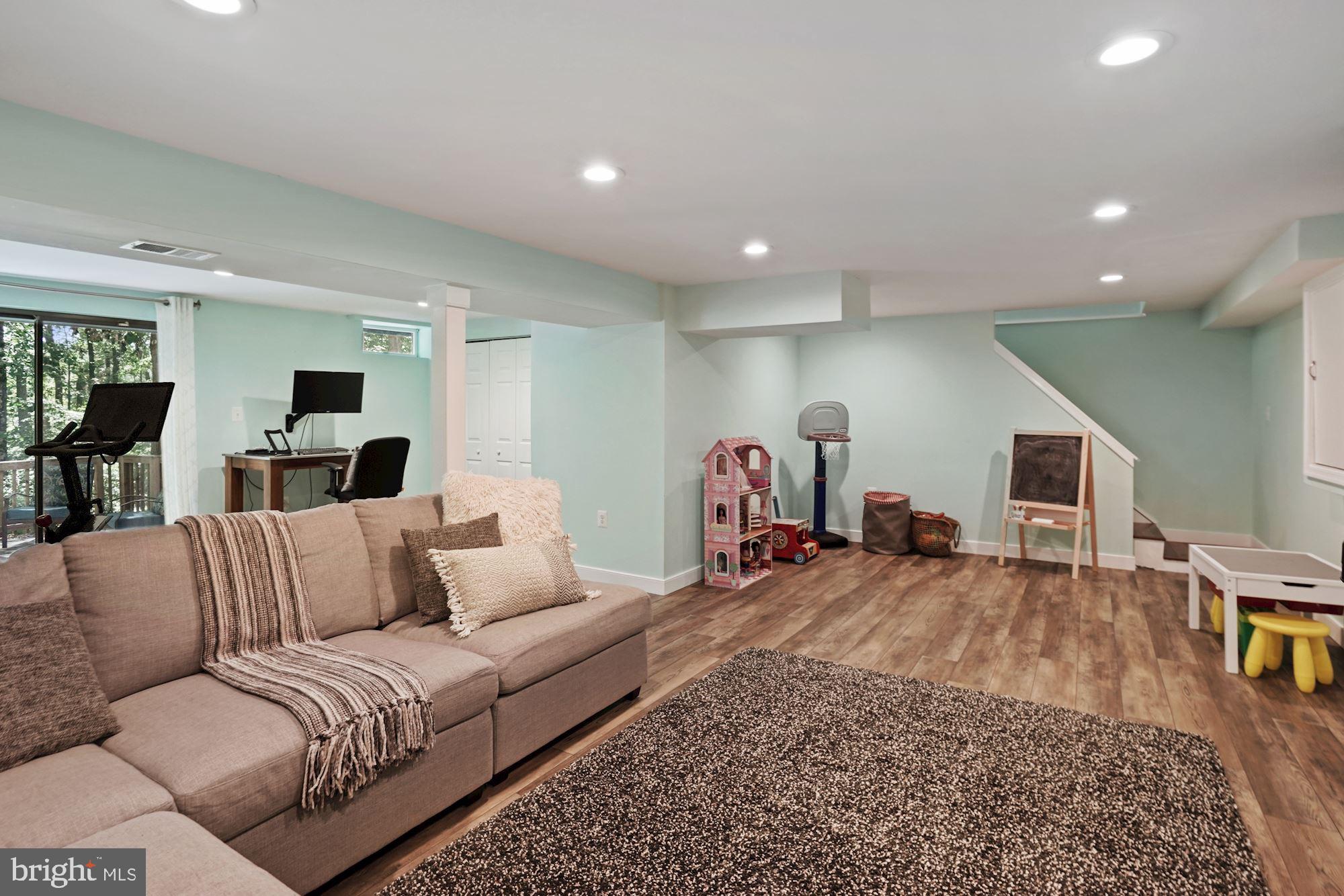 2119 Thomas View Road Reston, VA 20191 - Photo 34 of 41 a living room with furniture and a wooden floor