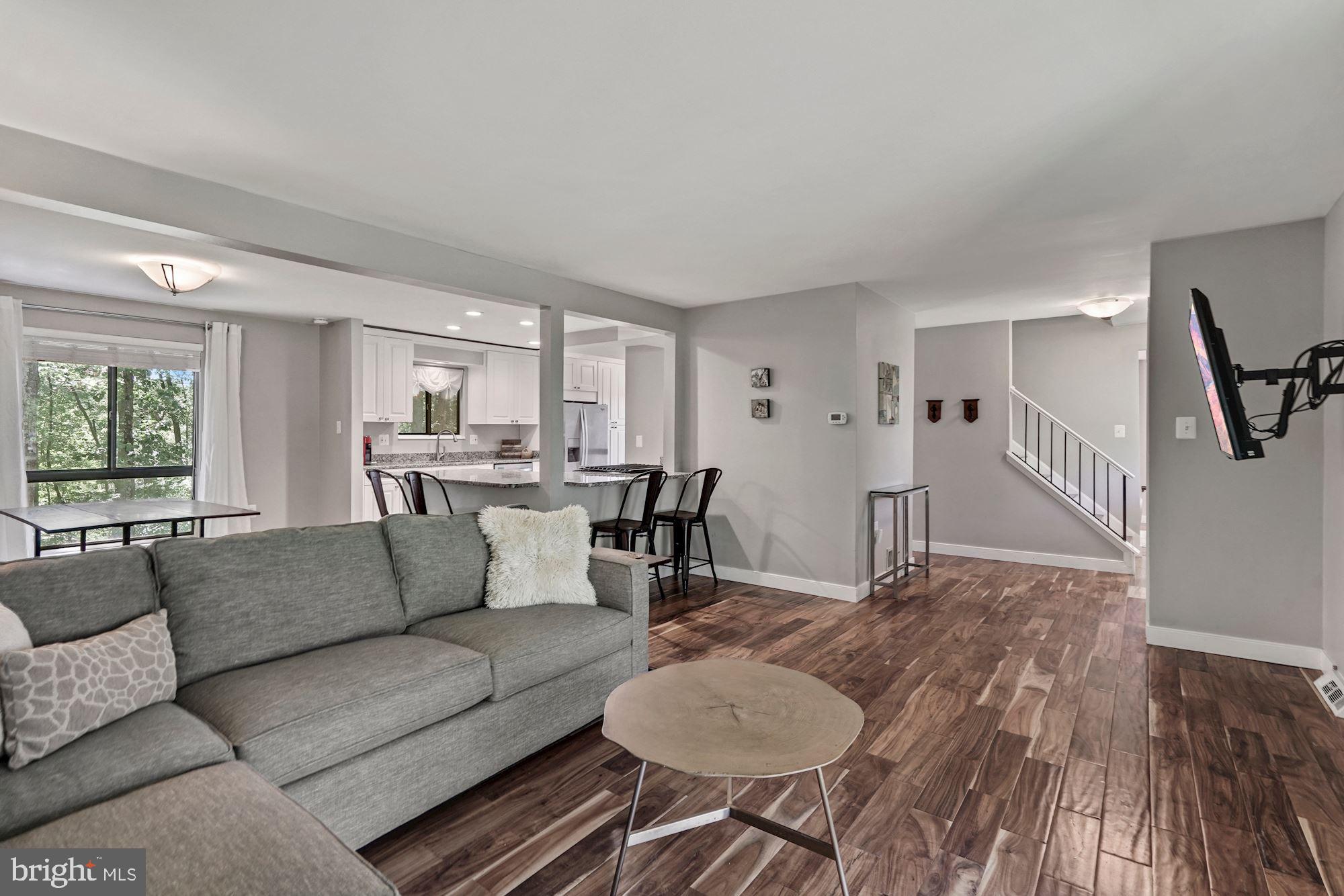 2119 Thomas View Road Reston, VA 20191 - Photo 41 of 41 a living room with furniture and a wooden floor