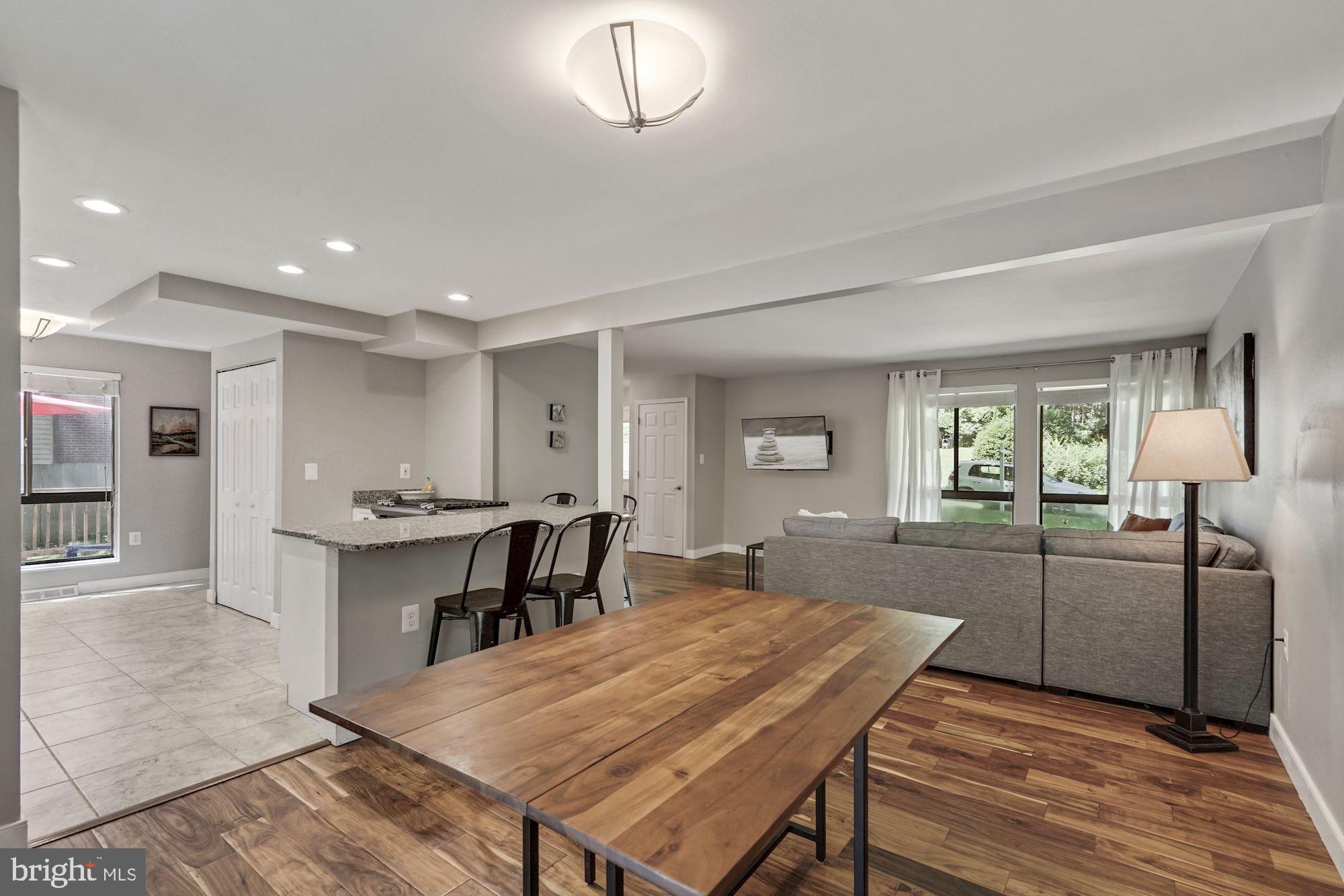2119 Thomas View Road Reston, VA 20191 - Photo 8 of 41 a kitchen with a table and chairs in it
