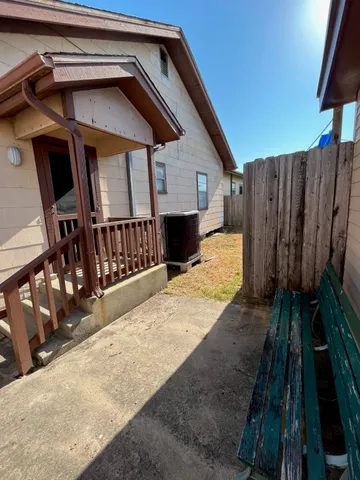 a view of a balcony with wooden floor