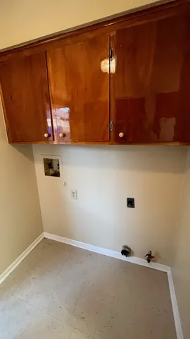 a kitchen with stainless steel appliances a stove a sink a refrigerator and cabinets