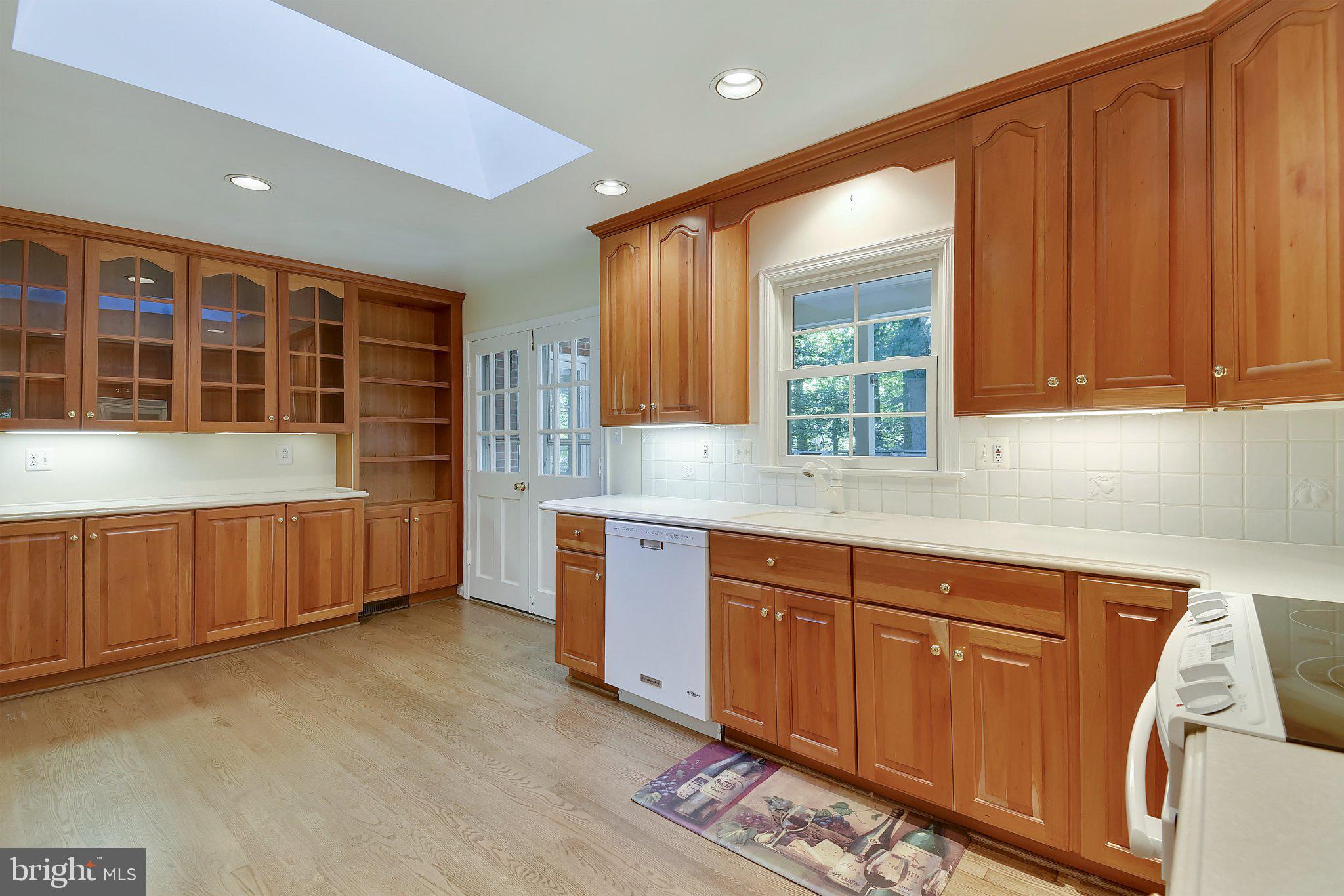 2025 Post Road Vienna, VA 22181 - Photo 11 of 24 Kitchen with Wood Floors and Skylights
