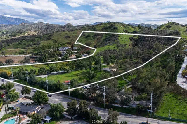 a view of a balcony with flower plants