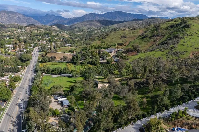 an aerial view of residential house and green space
