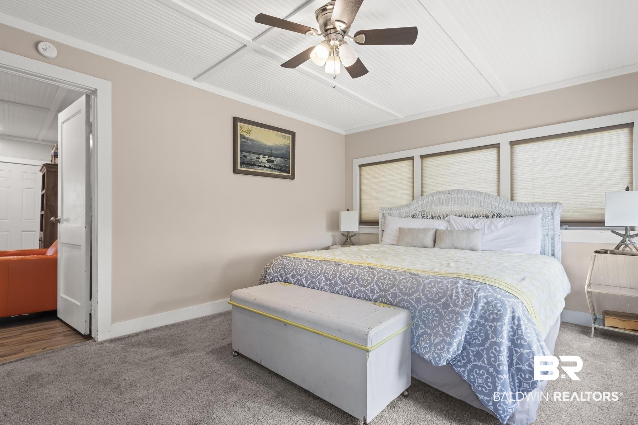 562 Veterans Road Gulf Shores, AL 36542 - Photo 16 of 32 Bedroom featuring carpet flooring, baseboards, and ceiling fan