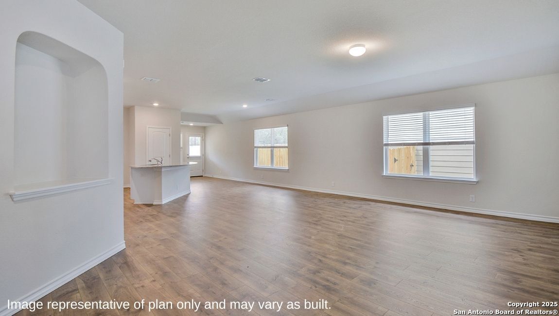 608 Fluted Shoals Cibolo, TX 78108 - Photo 3 of 36 an empty room with wooden floor and windows