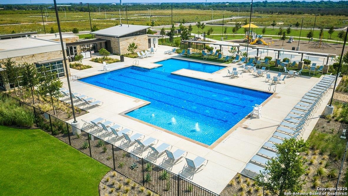 608 Fluted Shoals Cibolo, TX 78108 - Photo 33 of 36 a view of a swimming pool with a patio