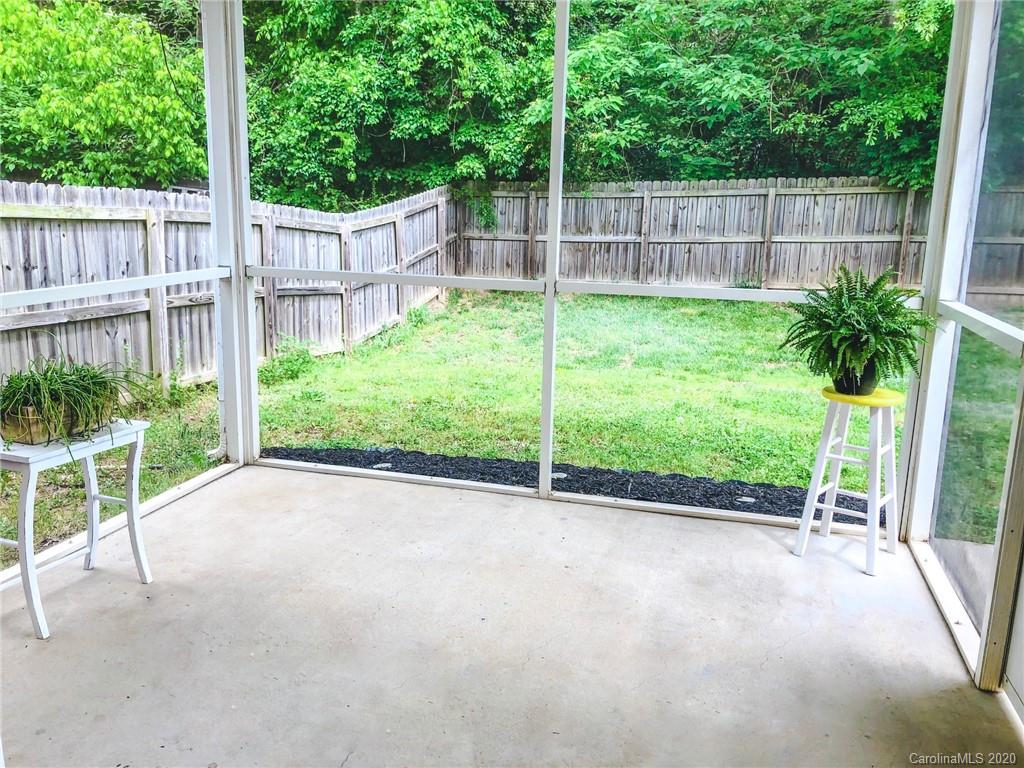 709 Jones Branch Road Fort Mill, SC 29715 - Photo 22 of 25 a view of a backyard with a garden and deck