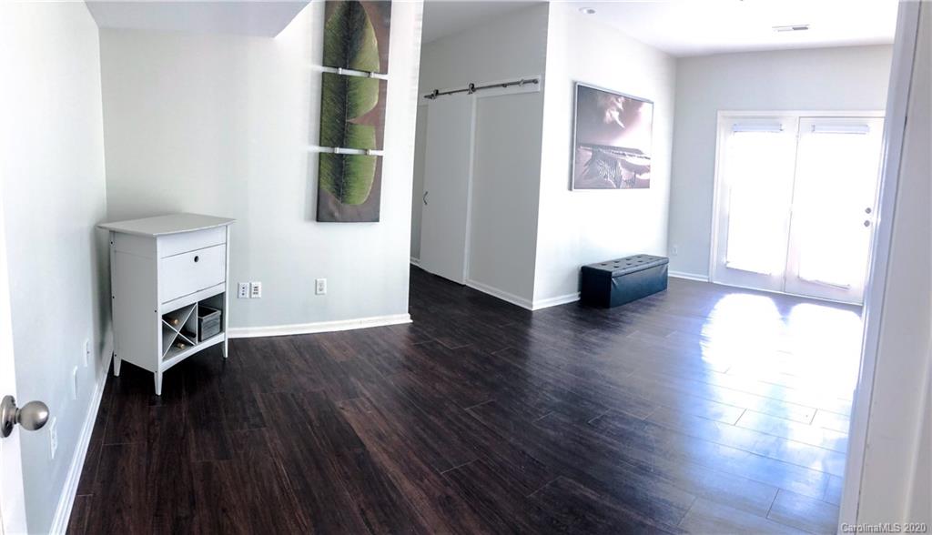 709 Jones Branch Road Fort Mill, SC 29715 - Photo 6 of 25 an empty room with wooden floor and windows