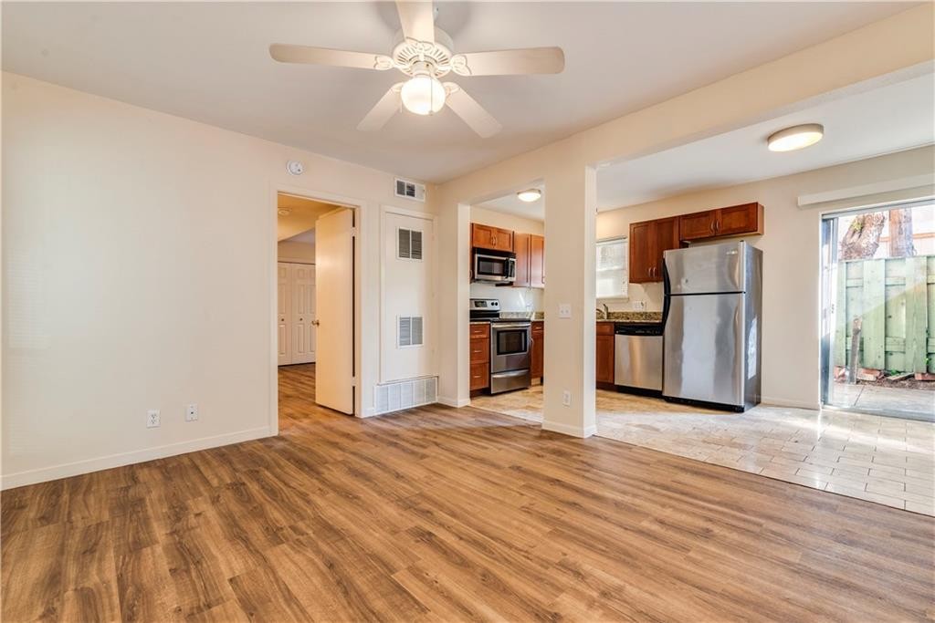 2800 Cole Street, Unit 107C Austin, TX 78705 - Photo 13 of 13 a view of a kitchen with a stove cabinets and wooden floor