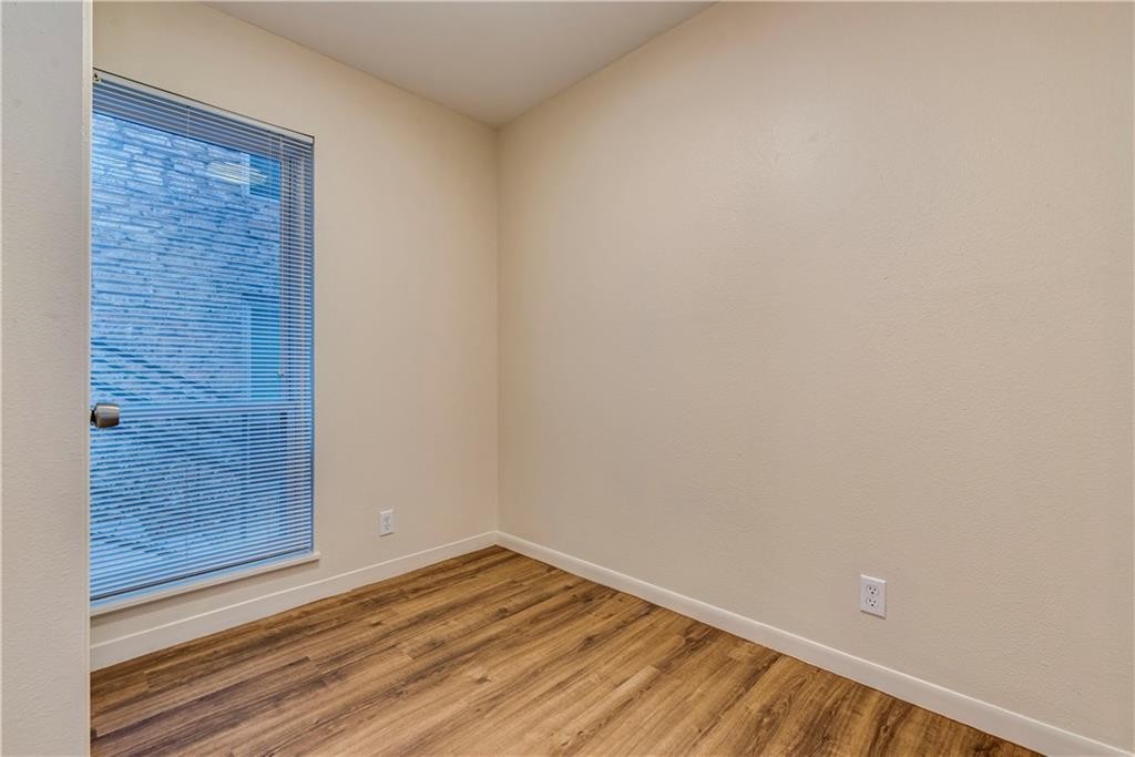 2800 Cole Street, Unit 107C Austin, TX 78705 - Photo 8 of 13 a view of empty room with wooden floor