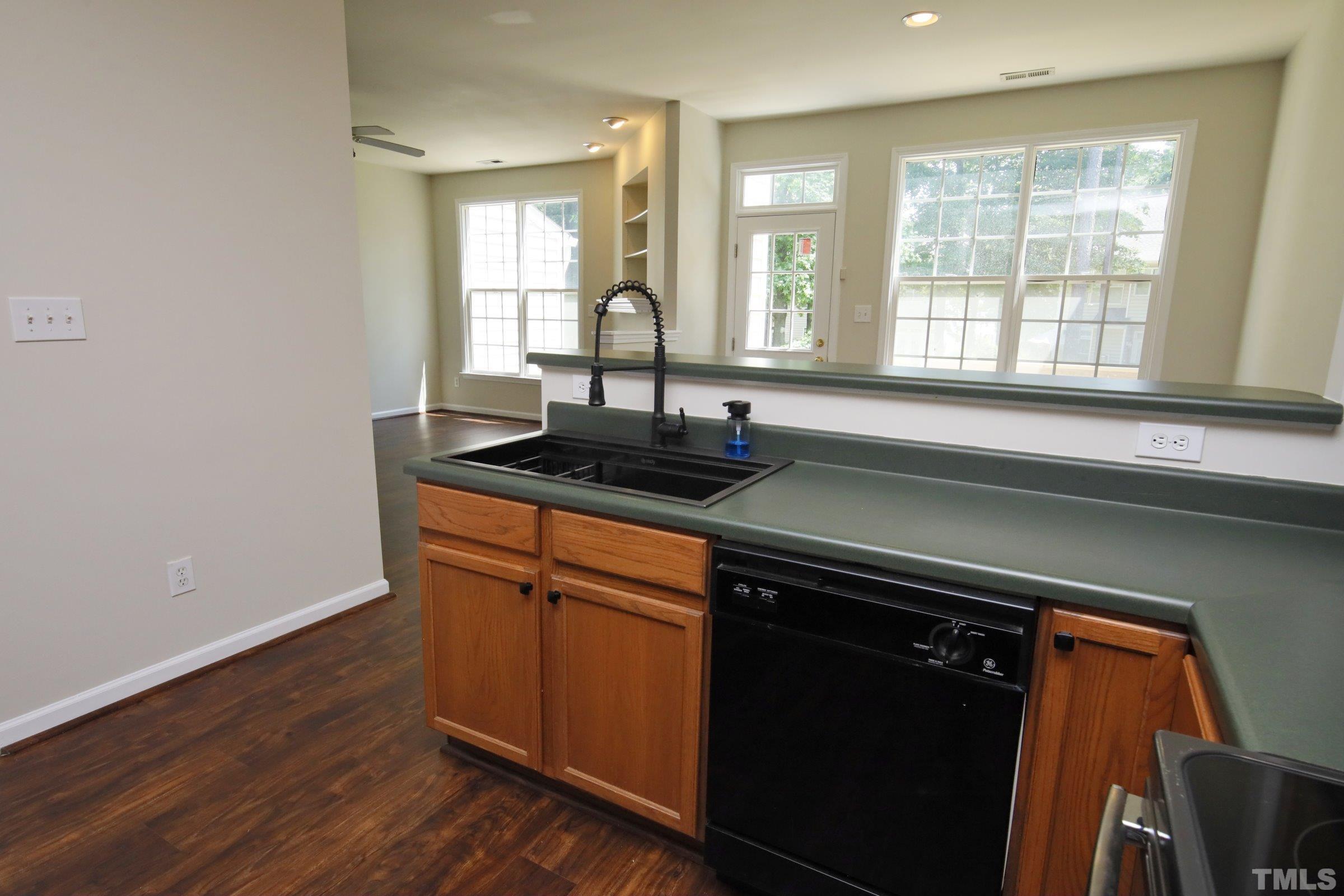 5633 Slide Rock Lane Raleigh, NC 27613 - Photo 13 of 32 a view of a kitchen counter space and windows