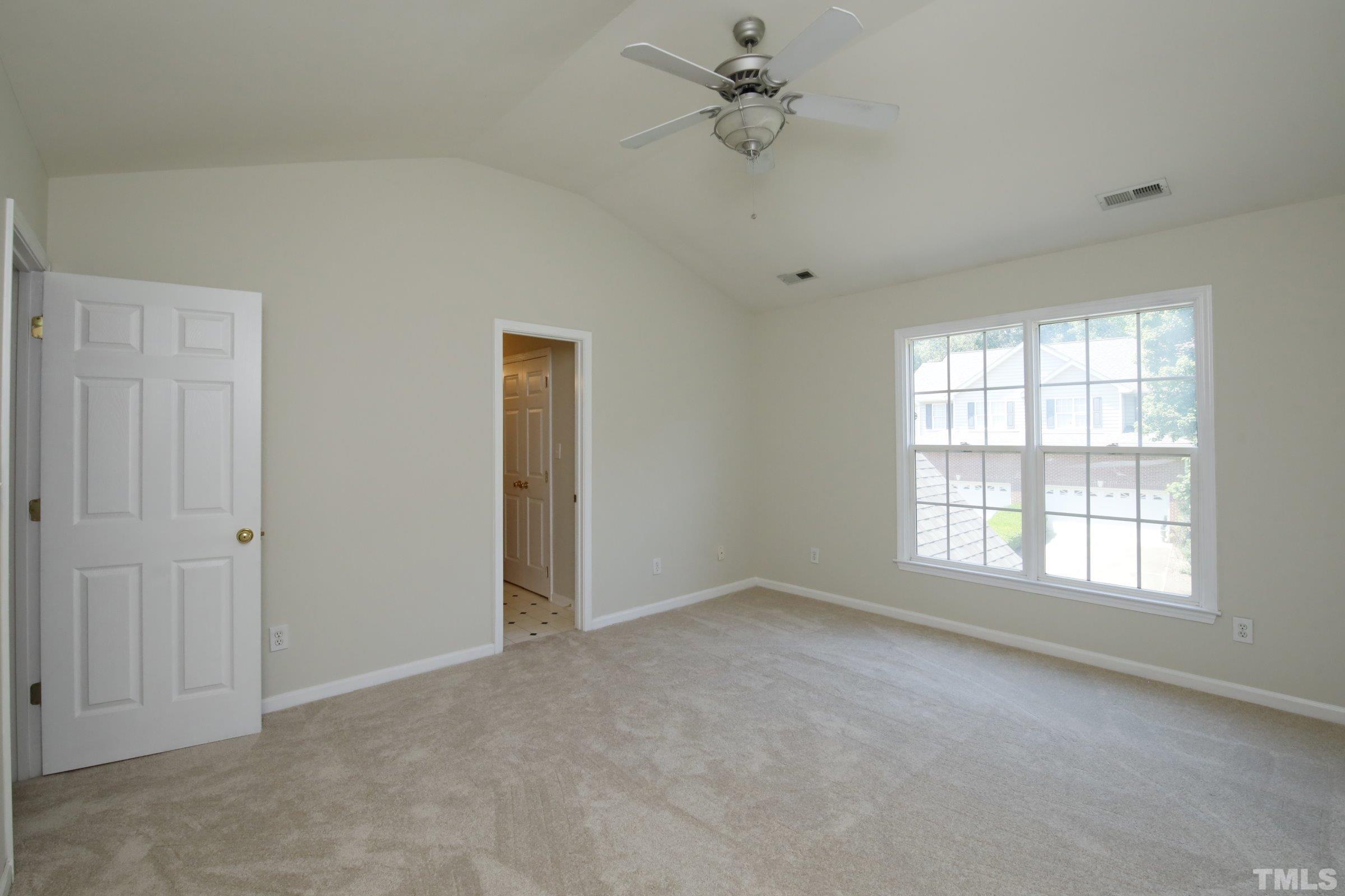 5633 Slide Rock Lane Raleigh, NC 27613 - Photo 19 of 32 a view of an empty room with a window