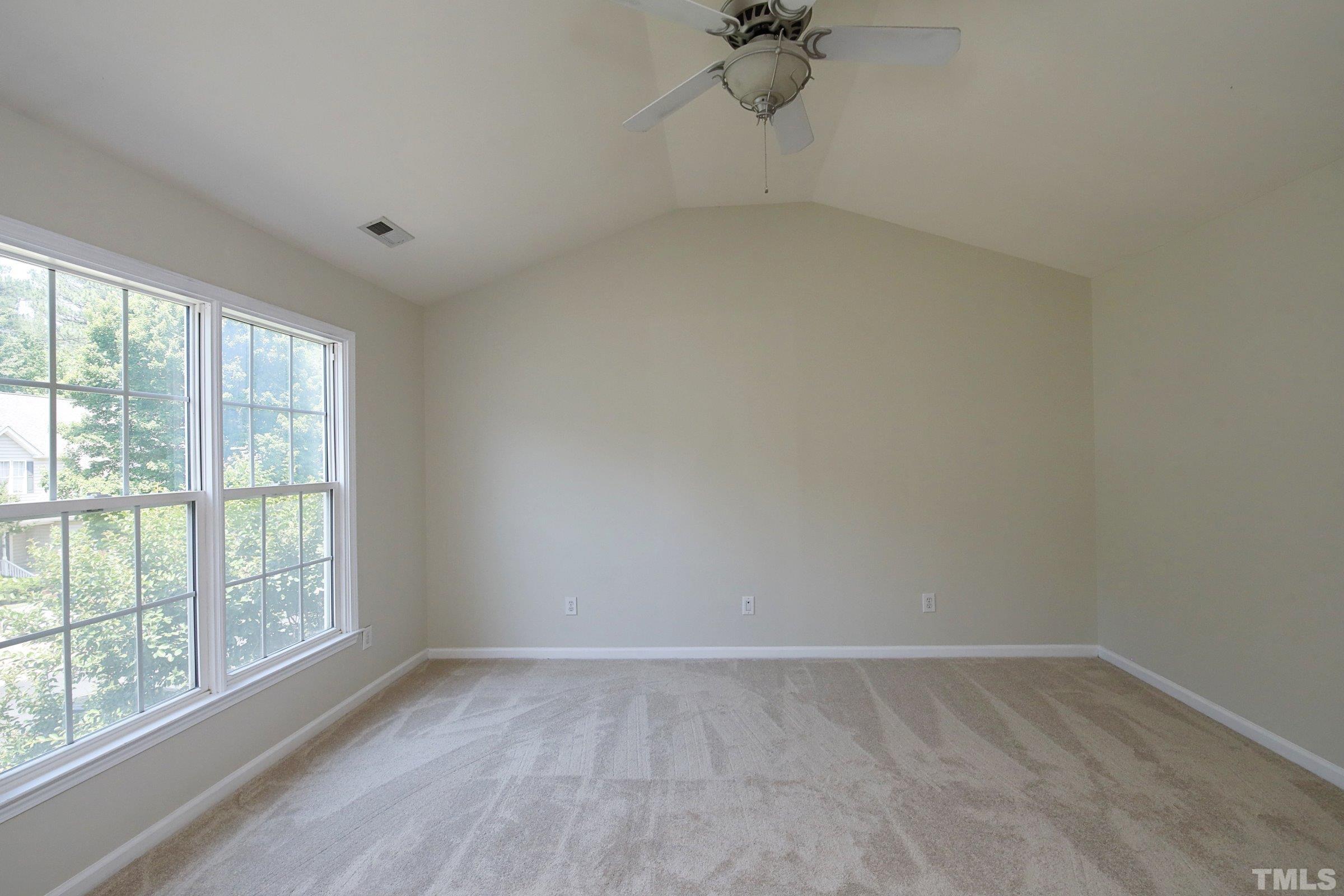 5633 Slide Rock Lane Raleigh, NC 27613 - Photo 20 of 32 a view of an empty room with a window