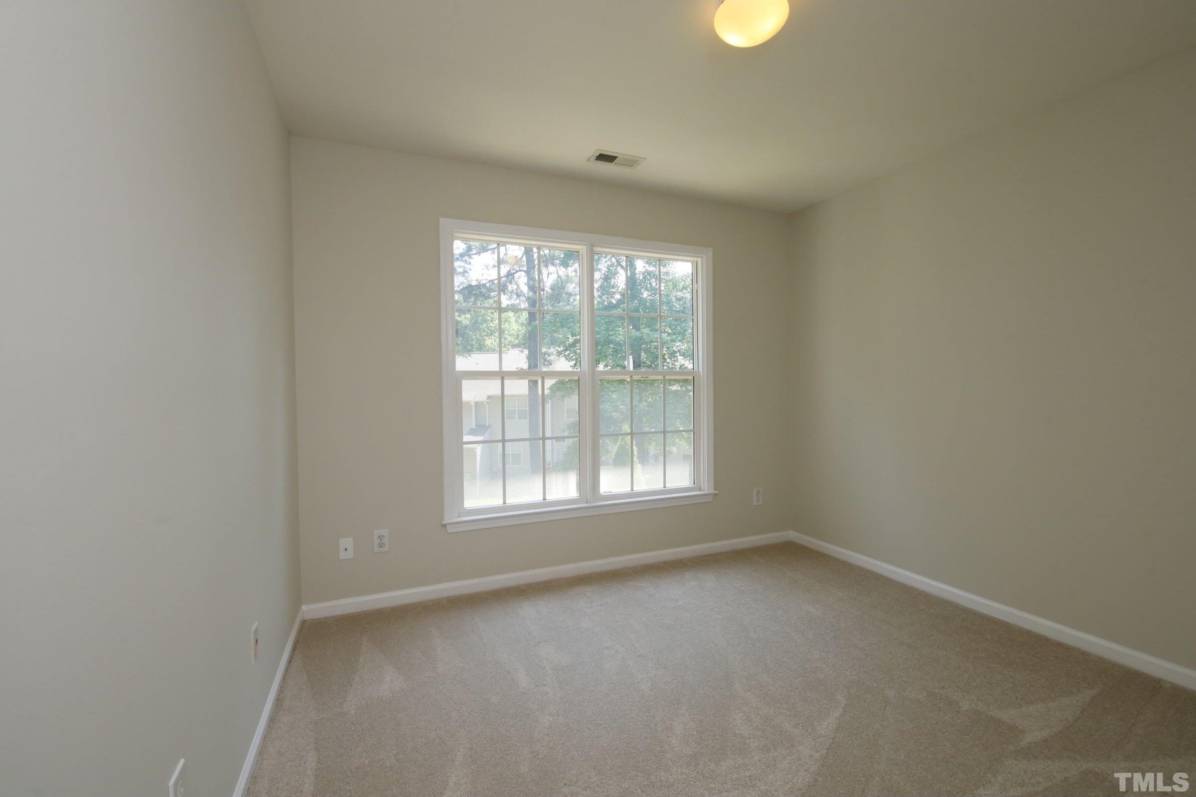 5633 Slide Rock Lane Raleigh, NC 27613 - Photo 25 of 32 an empty room with a window