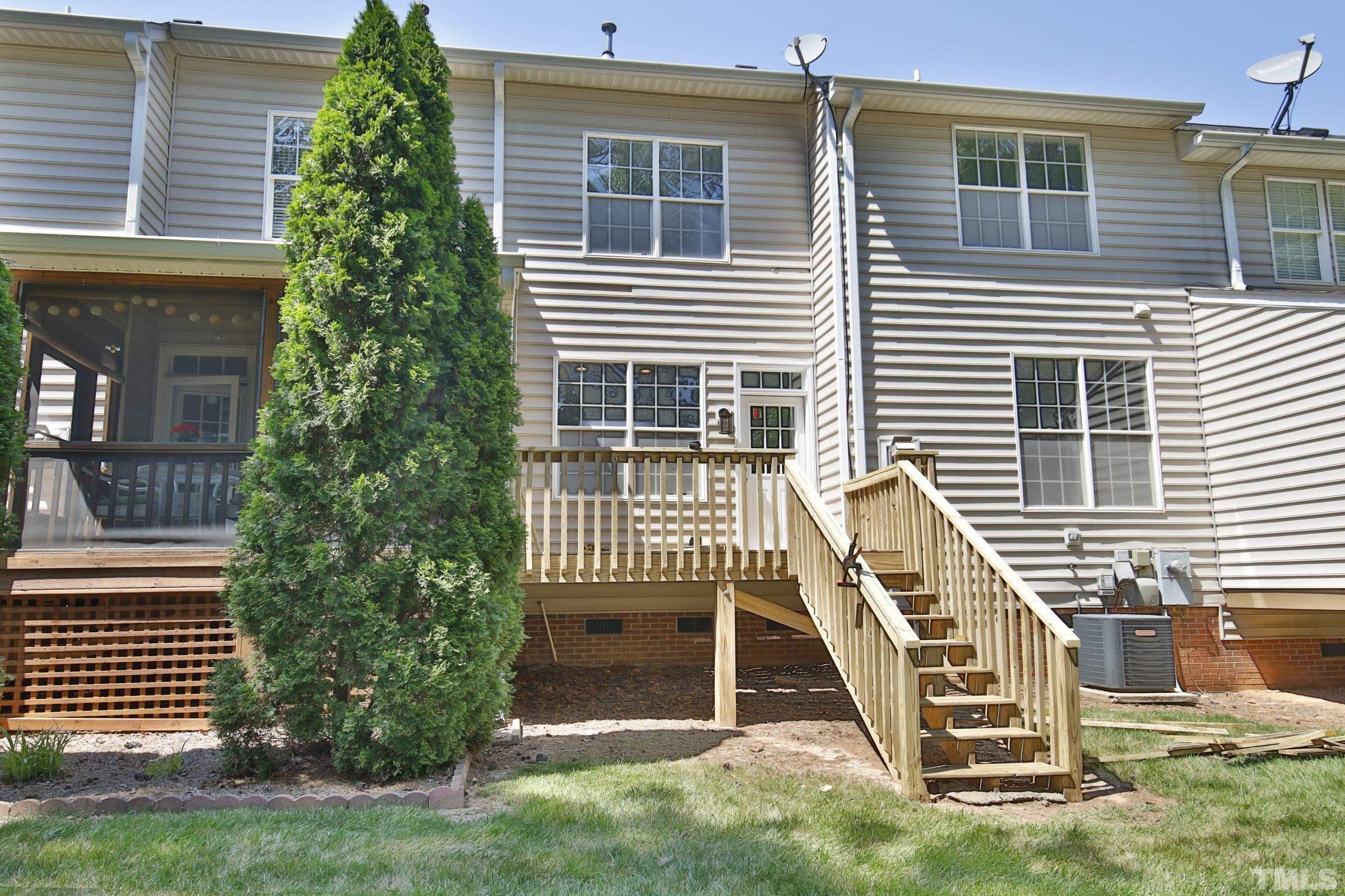 5633 Slide Rock Lane Raleigh, NC 27613 - Photo 27 of 32 a front view of a house with a yard