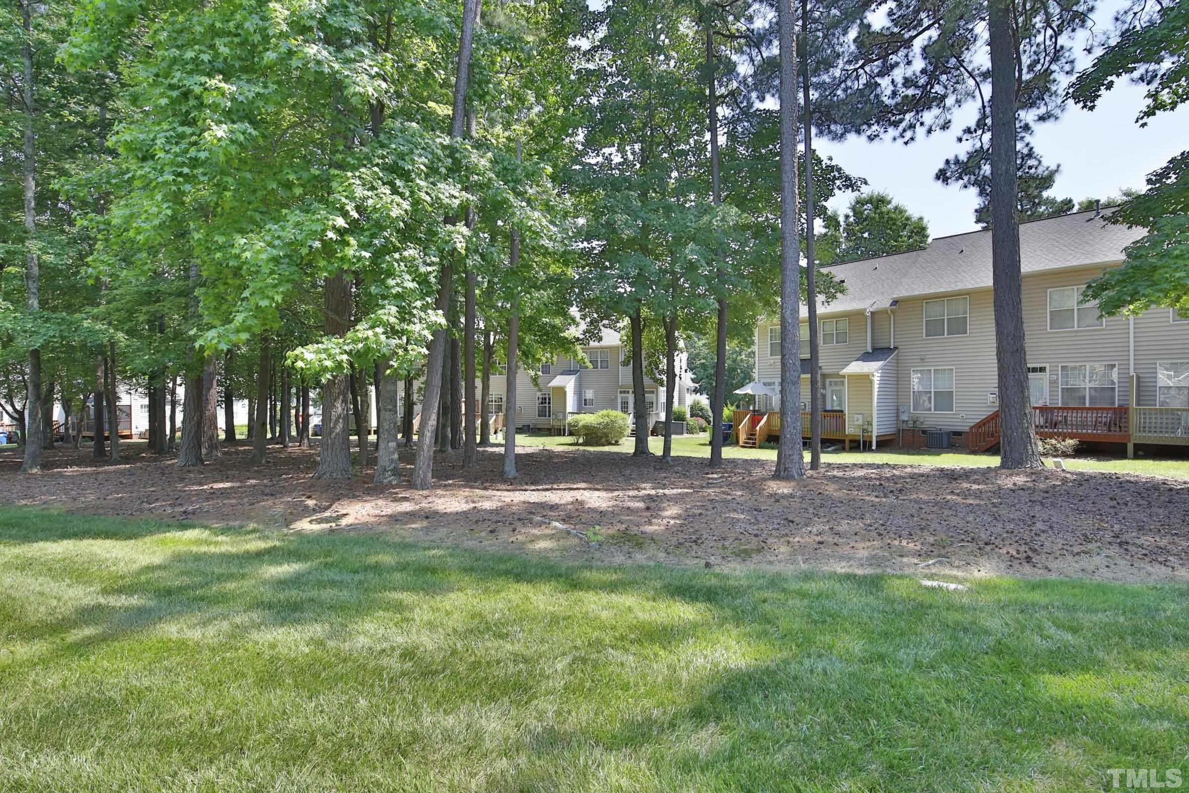 5633 Slide Rock Lane Raleigh, NC 27613 - Photo 30 of 32 a view of a yard with plants and trees
