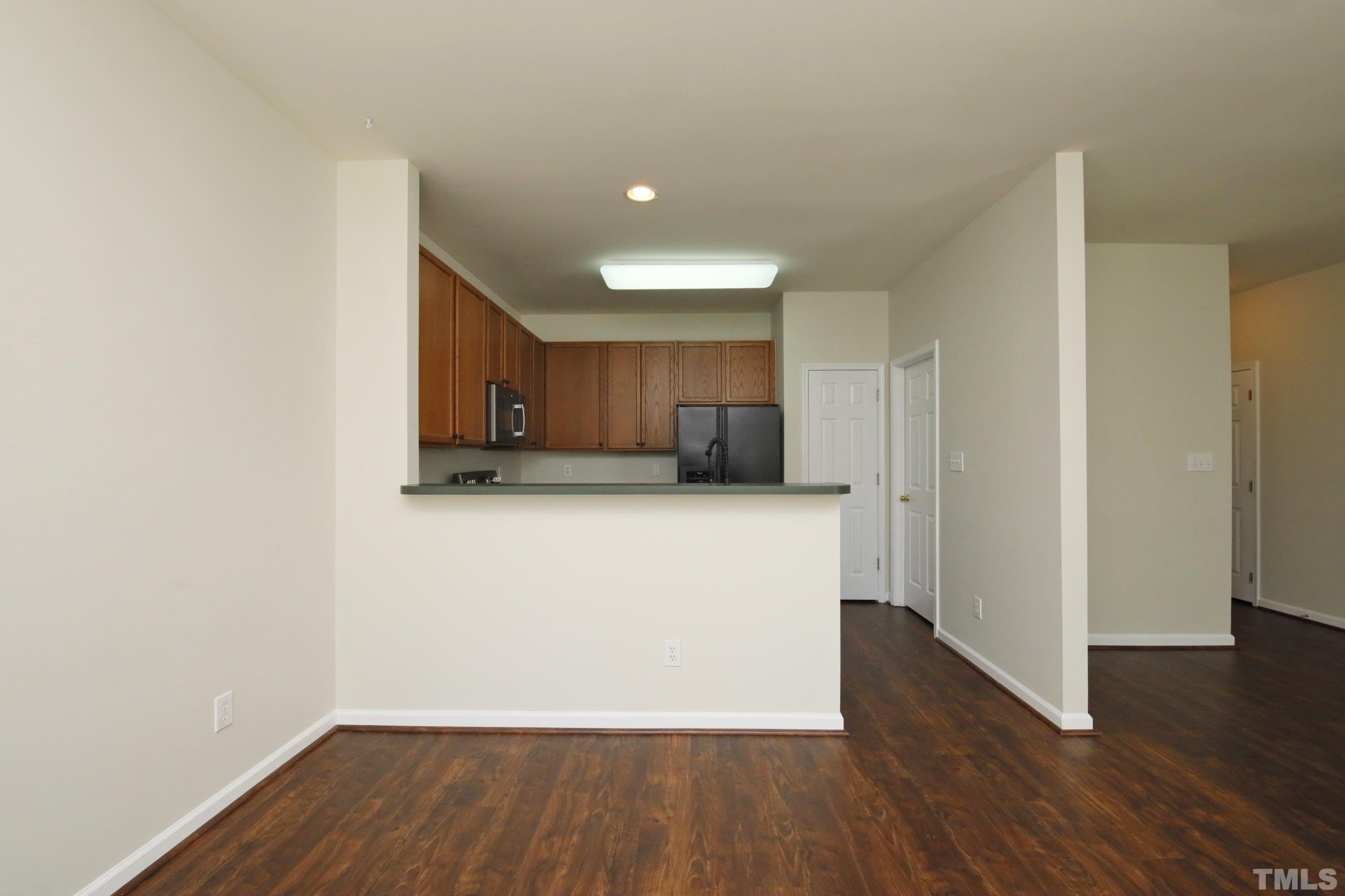 5633 Slide Rock Lane Raleigh, NC 27613 - Photo 10 of 32 a view of a kitchen with wooden floor