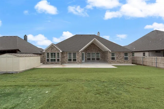 a front view of house with yard and seating area