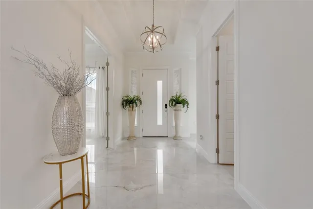 a view of an entryway with wooden floor