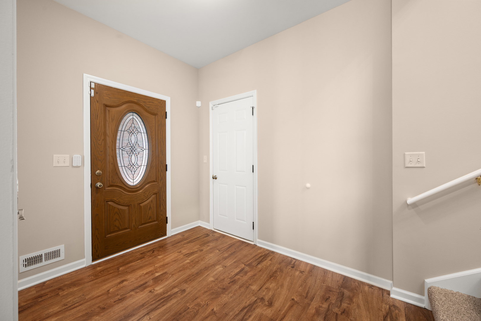 3705 Green Tree Lane DeKalb, IL 60115 - Photo 3 of 31 a view of an entryway with wooden floor