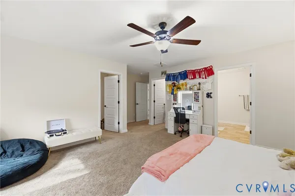 a bed room with a bed and a chandelier