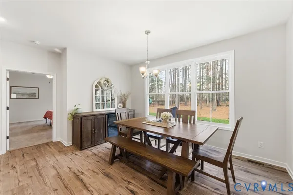 a dining room with furniture window wooden floor