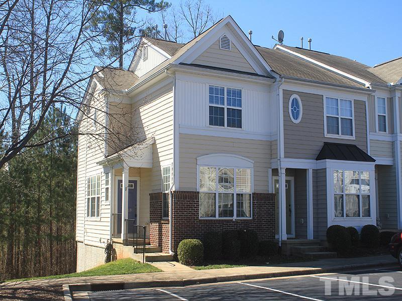 8449 Reedy Ridge Lane Raleigh, NC 27613 - Photo 1 of 12 a front view of a house with a yard