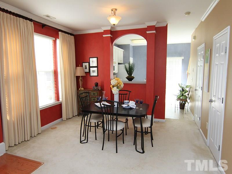 8449 Reedy Ridge Lane Raleigh, NC 27613 - Photo 4 of 12 a view of a dining room with furniture and a window