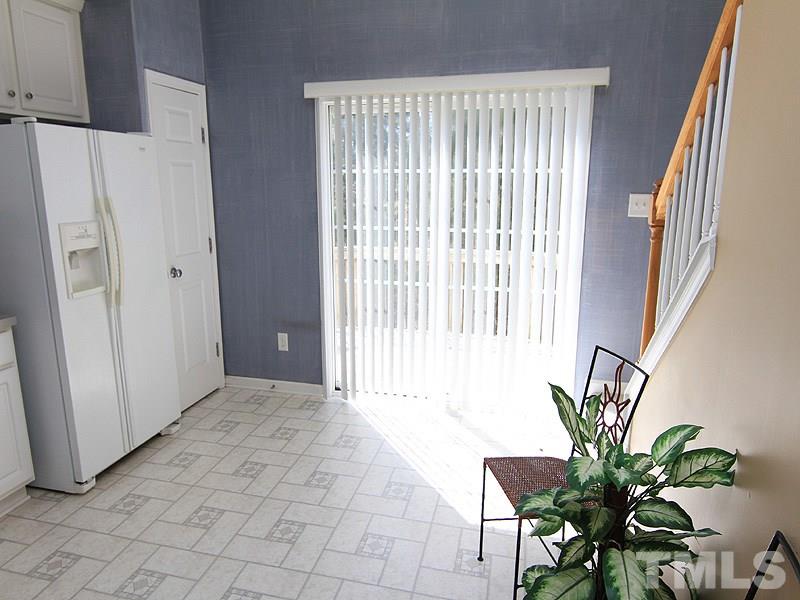 8449 Reedy Ridge Lane Raleigh, NC 27613 - Photo 6 of 12 a view of a room with a window and flower pot