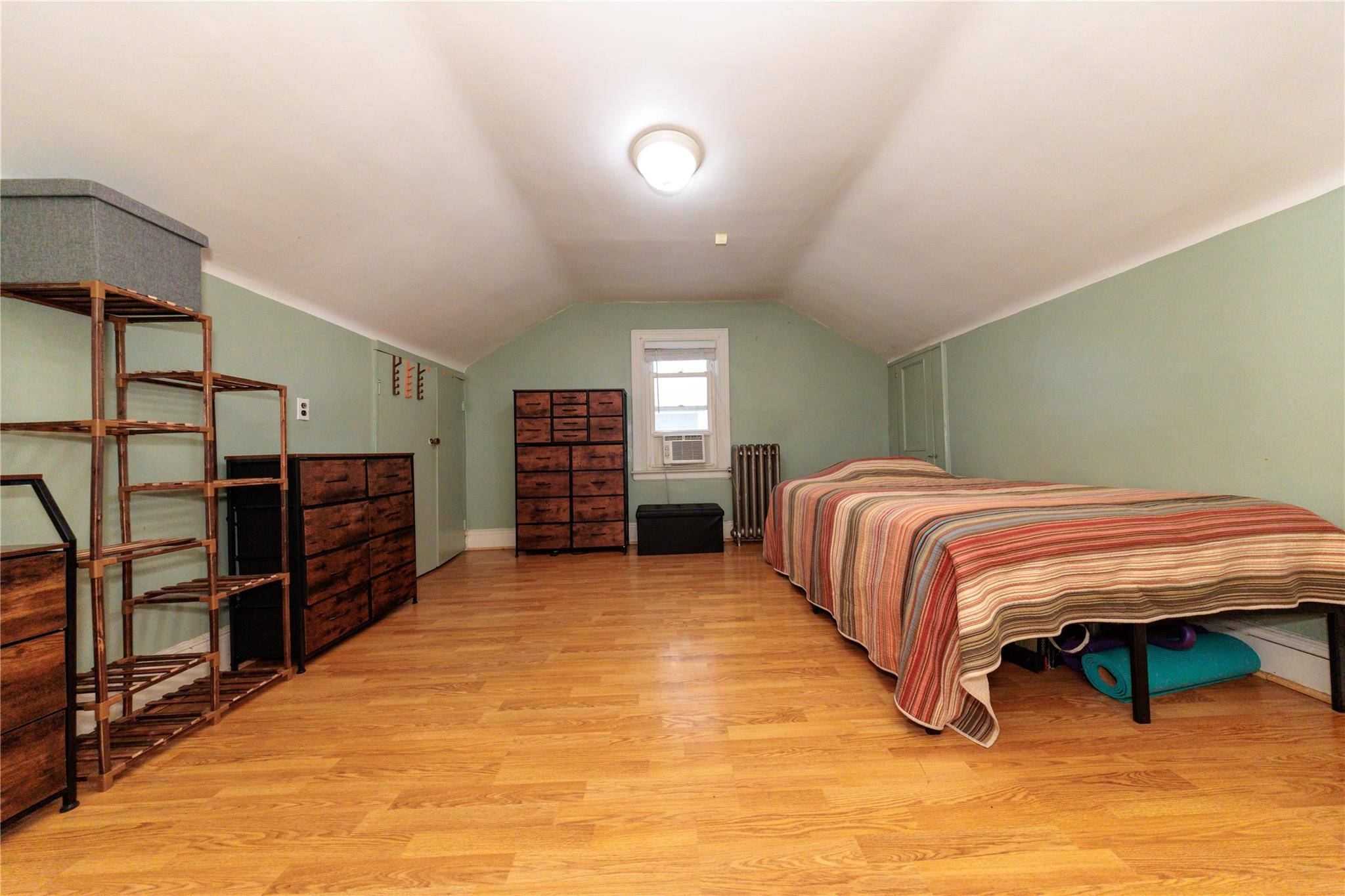 85-21 80th Street Queens, NY 11421 - Photo 23 of 39 a bedroom with a bed and a closet