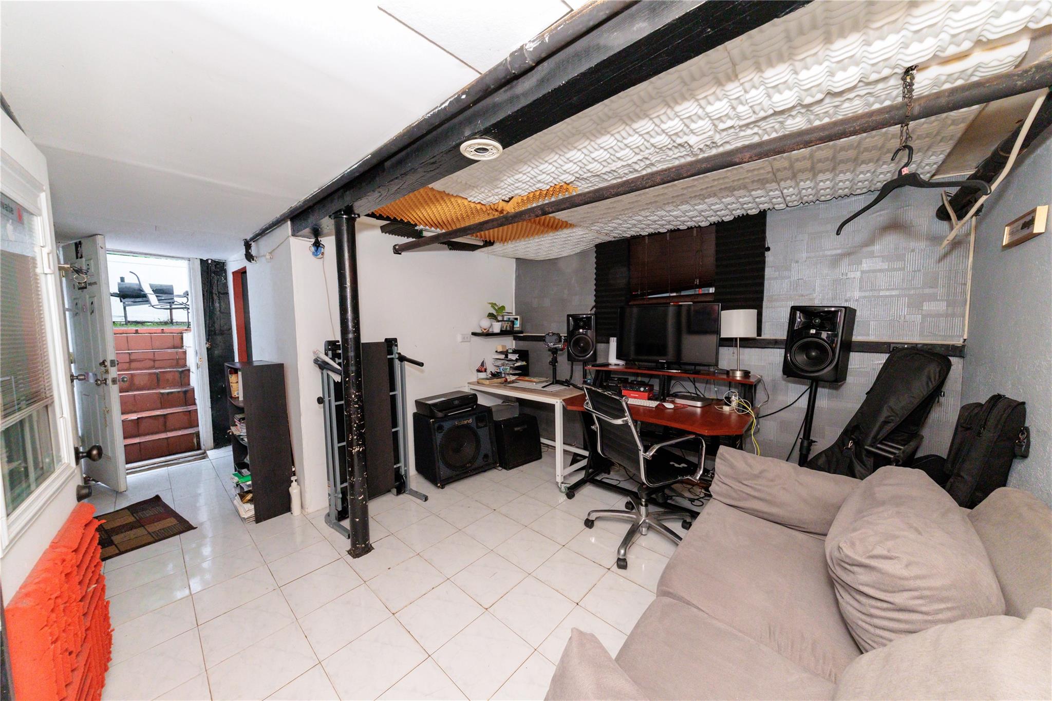 85-21 80th Street Queens, NY 11421 - Photo 30 of 39 a view of a room with gym equipment