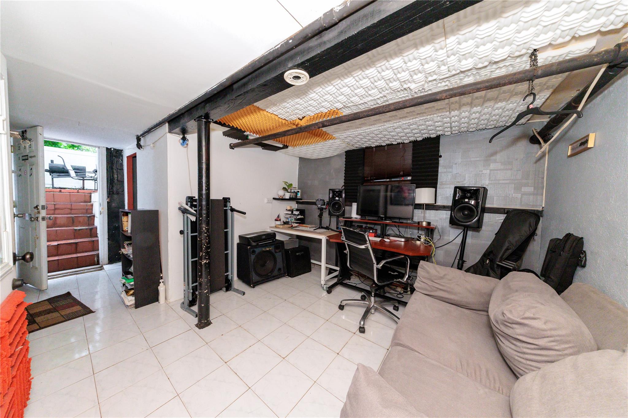 85-21 80th Street Queens, NY 11421 - Photo 31 of 39 a view of a room with gym equipment