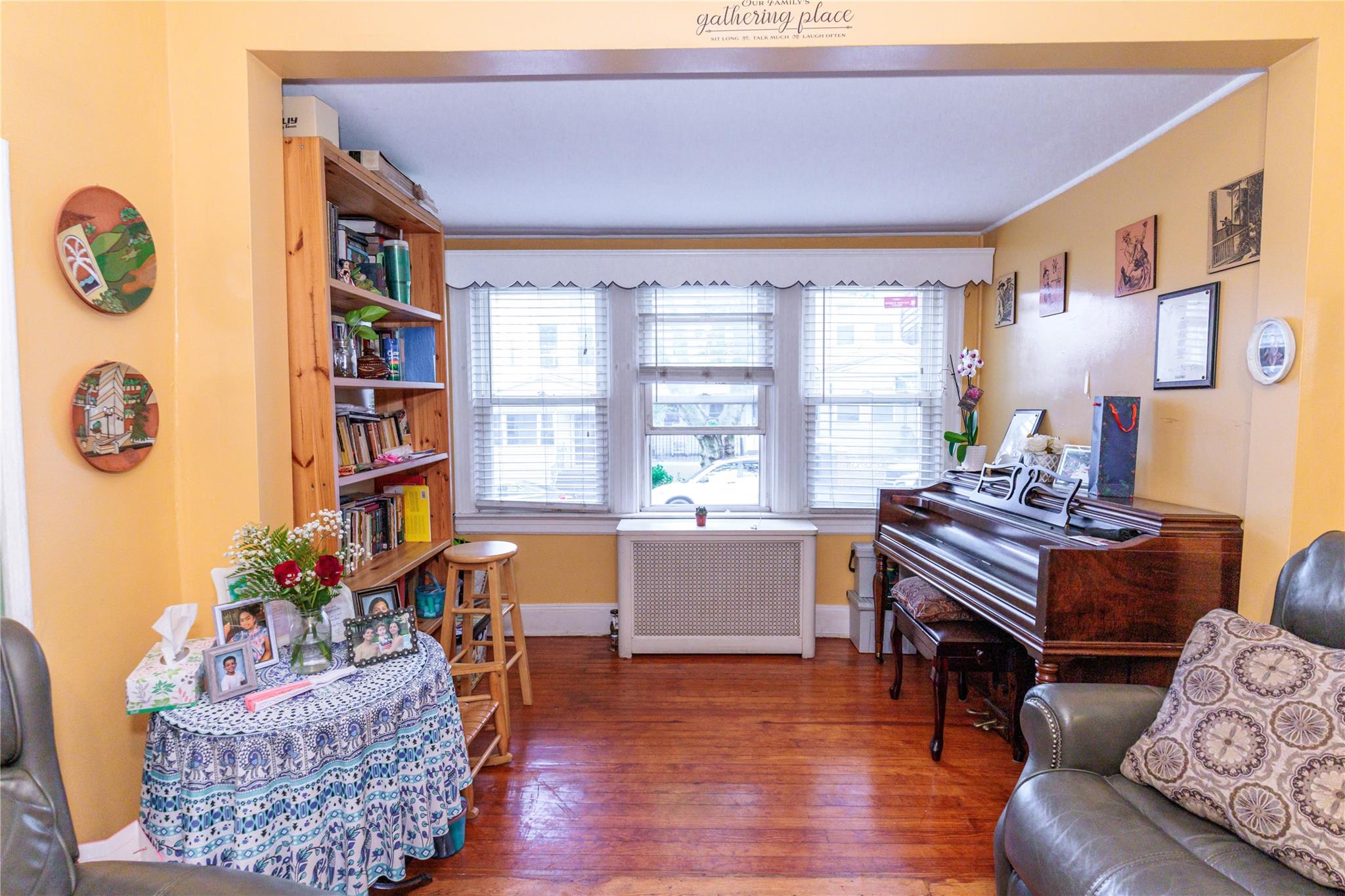 85-21 80th Street Queens, NY 11421 - Photo 7 of 39 a living room with furniture and a window