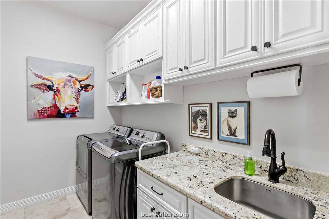 2816 Maroon Court Bryan, TX 77807 - Photo 24 of 30 Large laundry room with sink and extra strorage cabinets