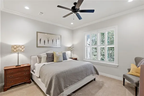 a spacious bedroom with a bed and a window