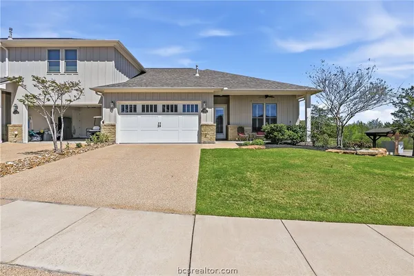 a view of a house with a yard porch and sitting area