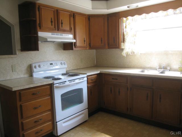 3034 Middletown Road Bethlehem, PA 18020 - Photo 5 of 14 a kitchen with a stove sink and cabinets