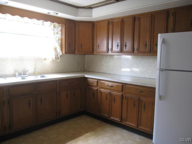 3034 Middletown Road Bethlehem, PA 18020 - Photo 6 of 14 a kitchen with a sink and a refrigerator