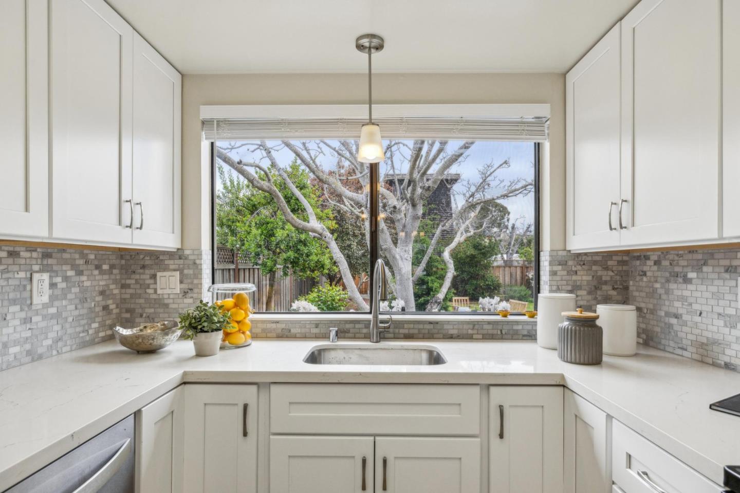 225 Arundel Road Burlingame, CA 94010 - Photo 29 of 58 a kitchen with a sink and a window
