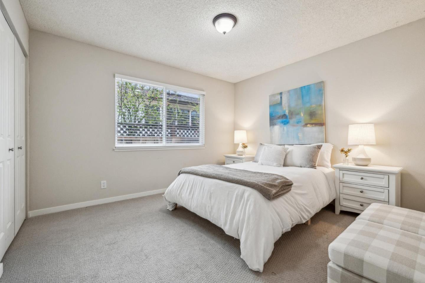 225 Arundel Road Burlingame, CA 94010 - Photo 34 of 58 a spacious bedroom with a bed and window