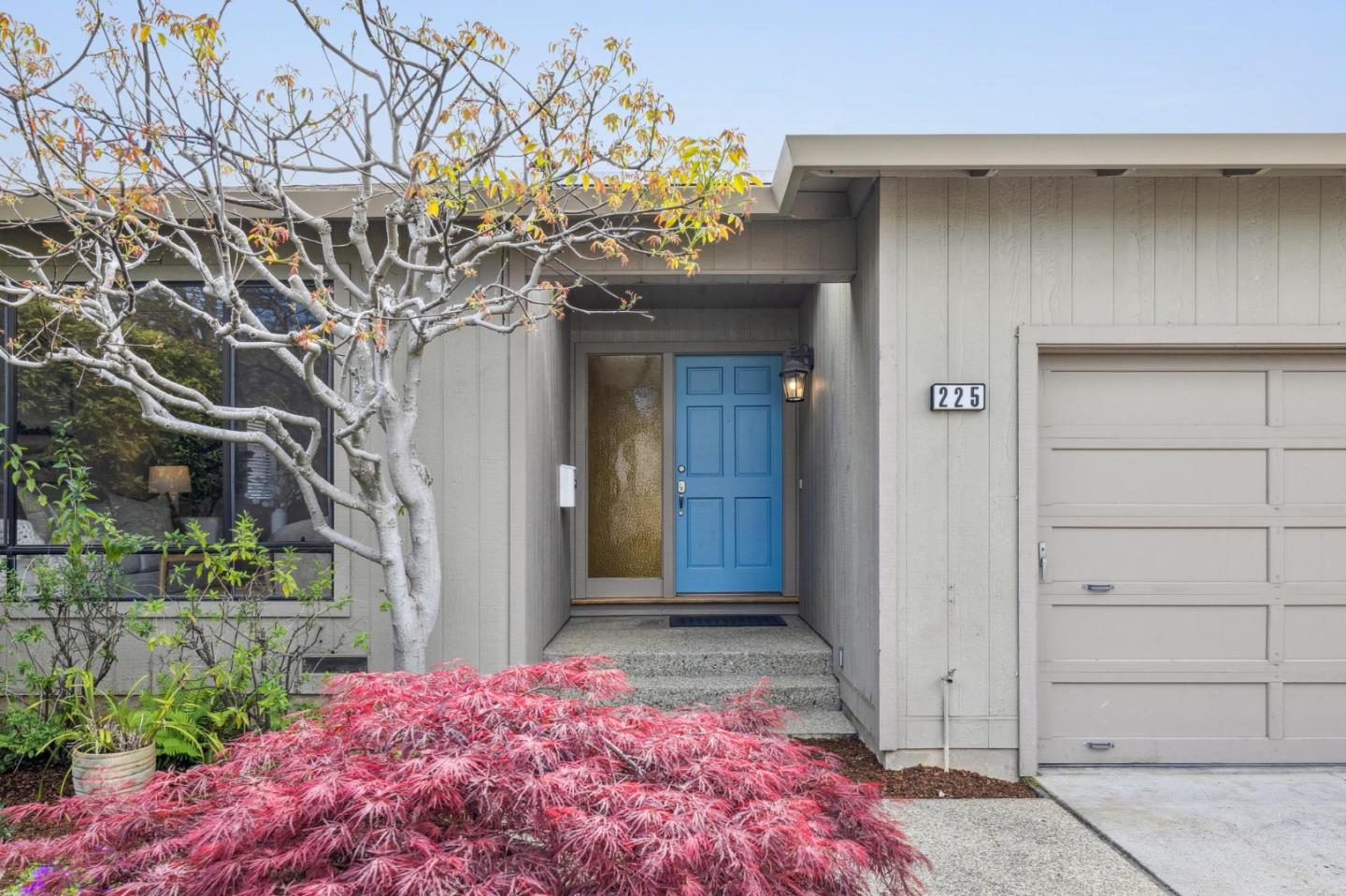 225 Arundel Road Burlingame, CA 94010 - Photo 4 of 58 a front view of a house with a garage