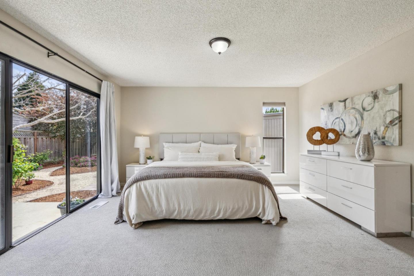 225 Arundel Road Burlingame, CA 94010 - Photo 41 of 58 a bedroom with a bed and a large window