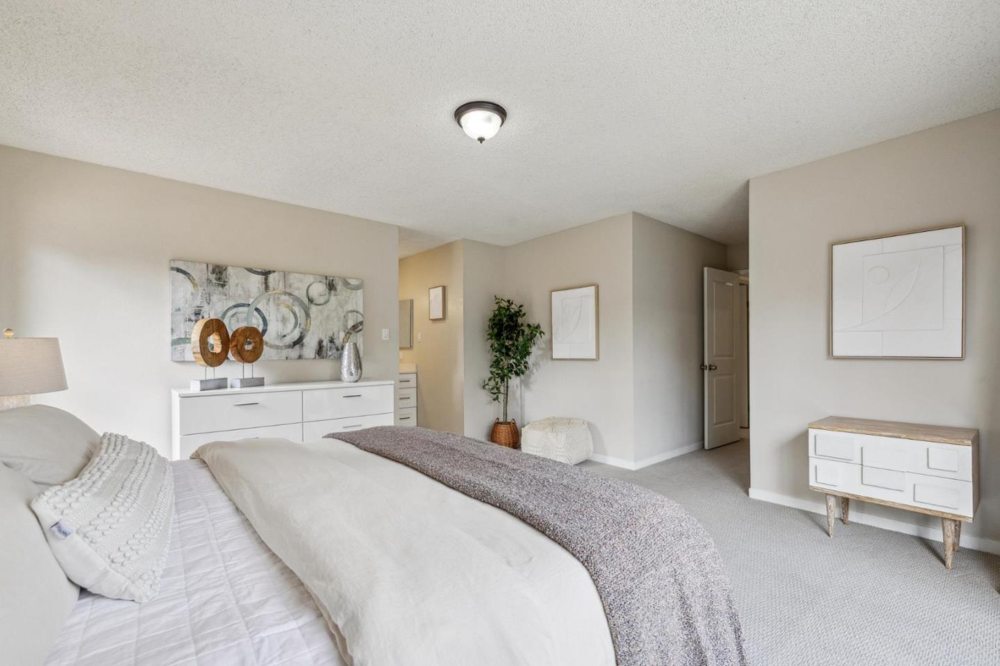 225 Arundel Road Burlingame, CA 94010 - Photo 45 of 58 a bedroom with a large bed and a window