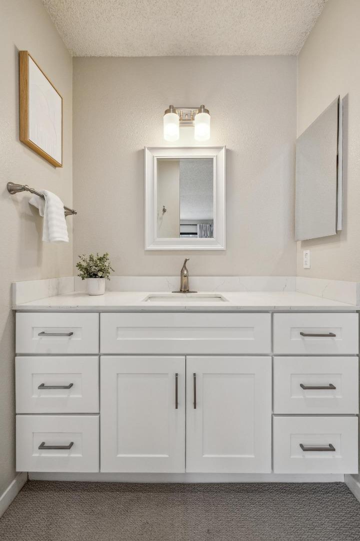 225 Arundel Road Burlingame, CA 94010 - Photo 48 of 58 a bathroom with a sink vanity and mirror